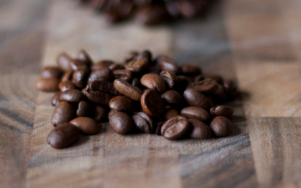 Fair trade coffee beans on cutting board.