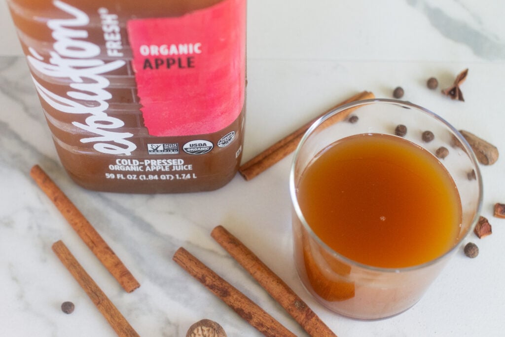 Evolution cold-pressed apple juice with whole spices for apple cider.