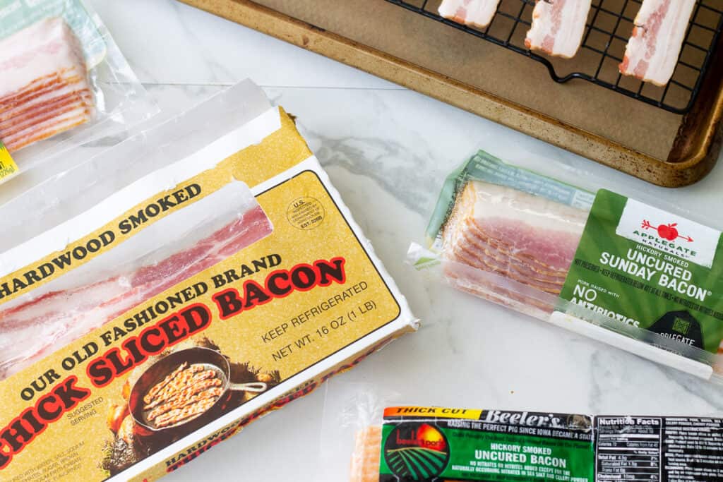 Different packages of bacon on counter