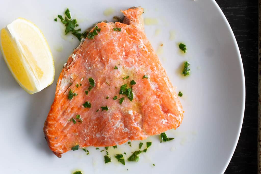 Grilled salmon on a plate with lemon vinaigrette