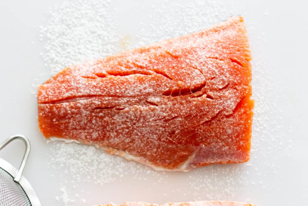 Salmon fillet with a thin coating of tapioca starch for pan-roasting