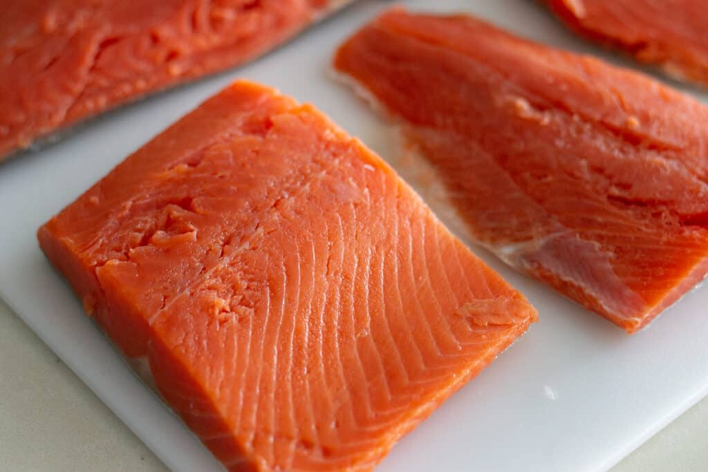 raw salmon on a cutting board