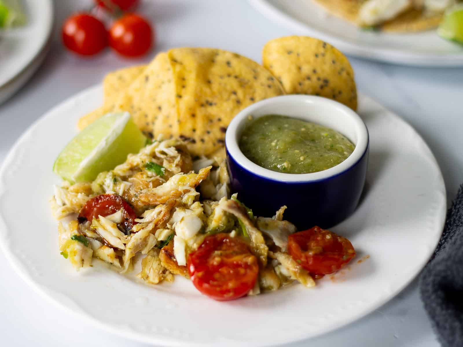Crockpot shredded chicken breast nachoes with salsa verde.